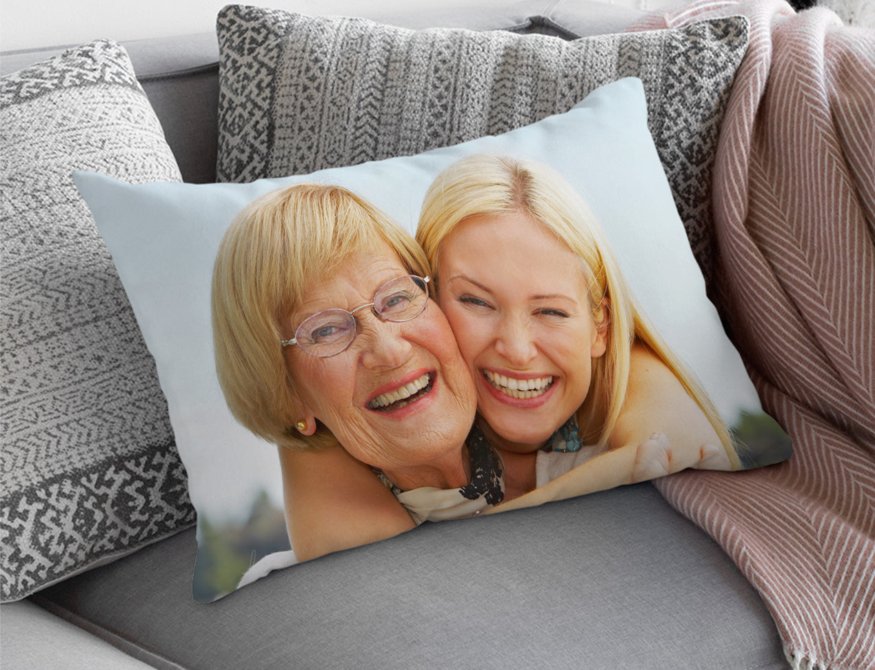 custom pillow case personalised with photo women and her mom. displayed on sofa.