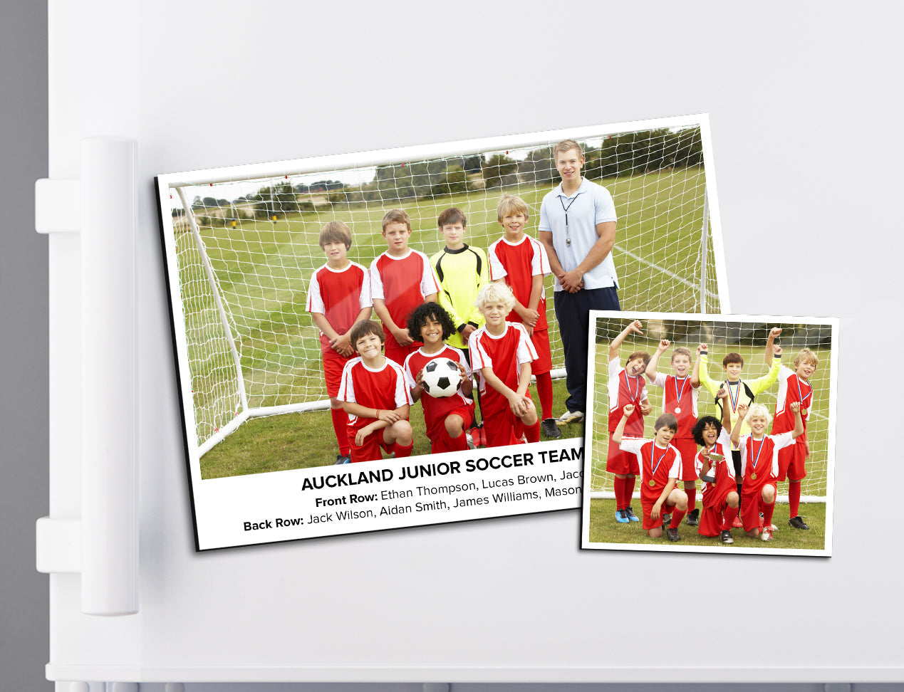 two photo magnets large with soccer team photos, displayed on the fridge