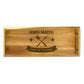 A large rectangular wooden serving tray with laser-engraved text 'King of the BBQ' and the name 'John Smith'.