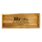 A large rectangular wooden serving tray with laser-engraved text 'Mr and Mrs Robertson' on the front.