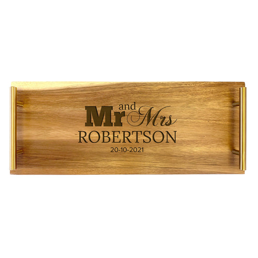 A large rectangular wooden serving tray with laser-engraved text 'Mr and Mrs Robertson' on the front.