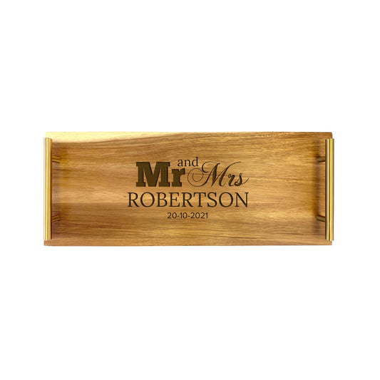 A small serving tray with 'MR & MRS ROBERTSON' engraved in gold lettering, made from high quality acacia wood.