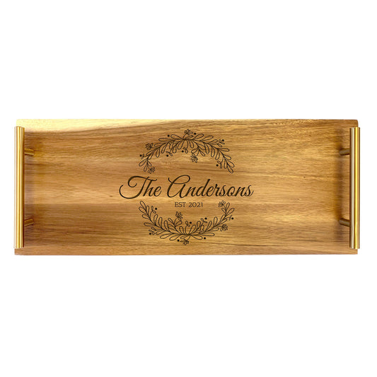 A large serving tray with a family wreath design engraved on the front, made from high quality acacia wood.