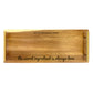 A wooden serving tray with laser-engaved text 'the secret ingredient is always love' and a space for a custom message.