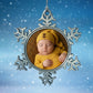 Custom Star-shapred Xmas decoration personalised with a baby in a yellow outfit against a snowy background
