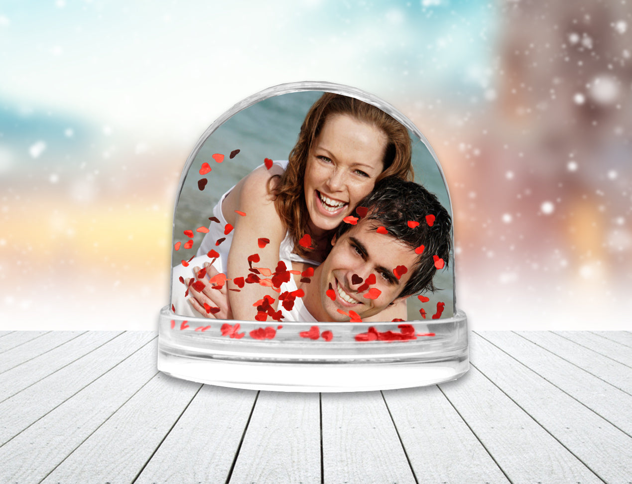 personalised snow globe, customised with photo of couple and heart glitter floating inside globe.