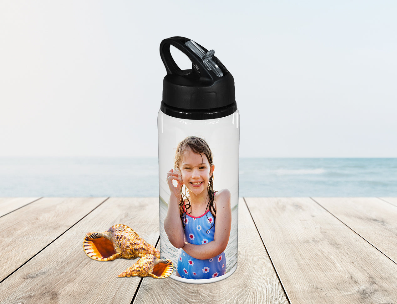 personalised water bottles. this sports drink bottle is customised with a photo of a kid.