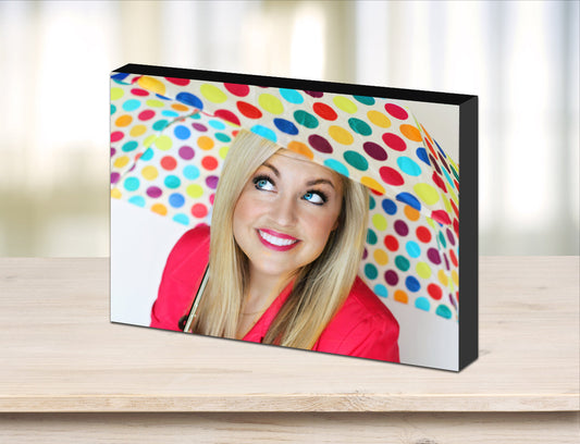 wooden photo block with black edges used as desk decoration